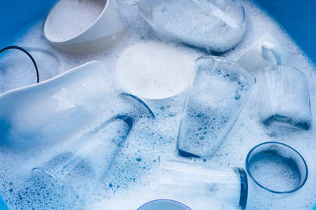 Washing used drinking glasses and cupsの写真素材