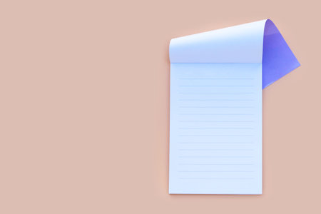 Notebook isolated on beige