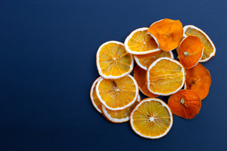 Sliced dry oranges on darkの写真素材