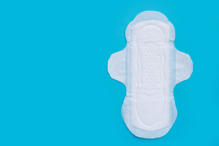 White sanitary napkin on blue background.の写真素材