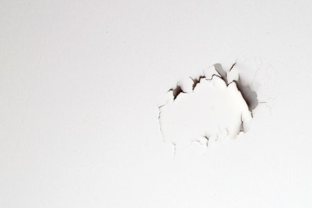 White color paint peeling off on ceiling house. Under the roofの写真素材