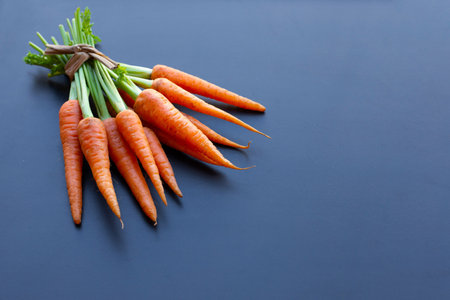 Fresh carrots on dark background.の写真素材