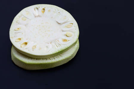 Sliced young jackfruit on dark background. Copy spaceの写真素材