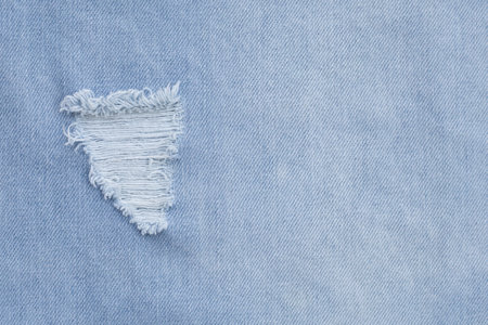 Close up of hole on jeans texture for background.の写真素材
