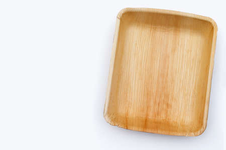Betel palm leaf plate on white background.の写真素材
