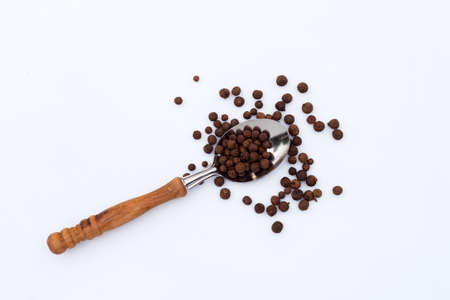 Allspice on white background. Copy space