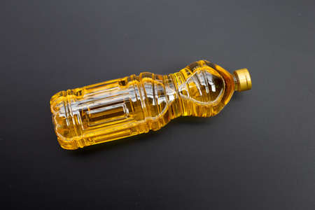 Rice bran oil on dark background.の写真素材