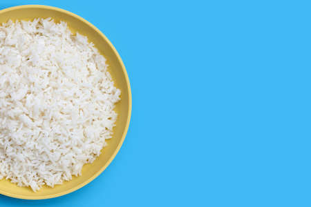 Dish of rice on blue background.の写真素材