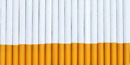 Cigarette on dark background. Non smoking for health conceptの写真素材