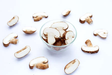 Fresh shiitake mushrooms on white background.