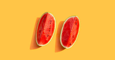 Watermelon on orange background. Summer background concept.の写真素材