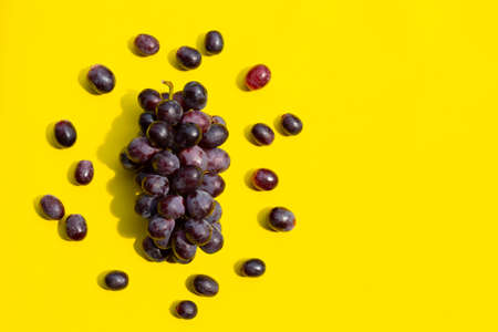 Fresh grape on yellow background.の写真素材