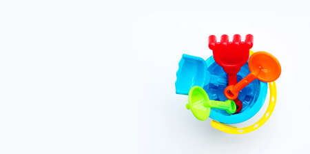 Shovels in bucket for sand on white background. Summer background conceptの写真素材