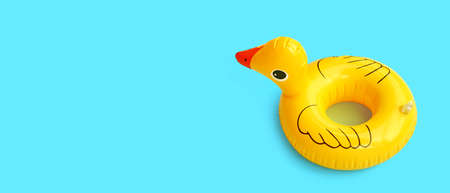 Inflatable of yellow duck on blue background. Summer background conceptの写真素材