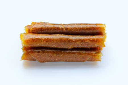 Dried mango paste on white background.