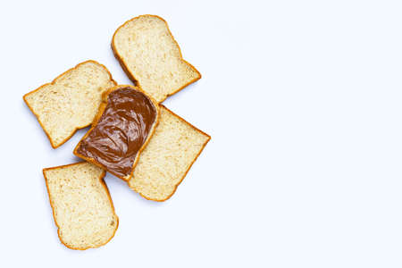 Bread with sweet chocolate hazelnut on white background.