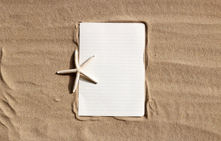 White paper with starfish on sand.の写真素材