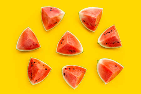 Watermelon on yellow surface. Top viewの写真素材