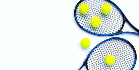 Tennis rackets with balls on white.の写真素材