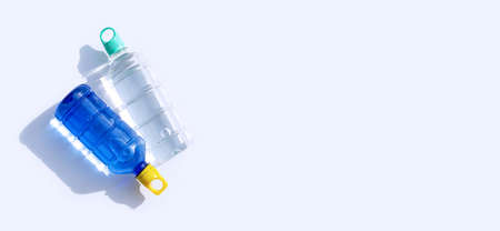 Plastic water bottles on white background.