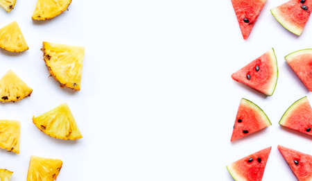Frame made of pineapple with watermelon slices on white background.