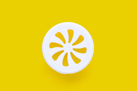 Air freshener on yellow background.の写真素材