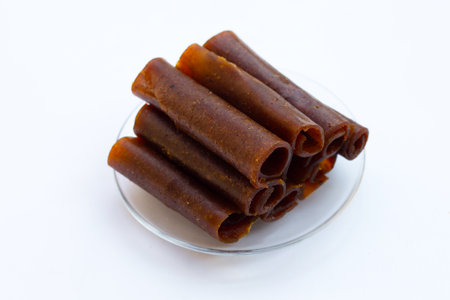 Dried mango paste on white background.の写真素材