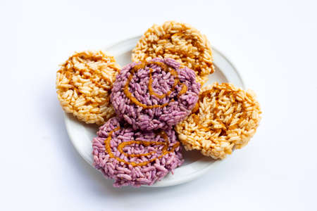 Rice cracker with coconut palm sugar on whiteの写真素材