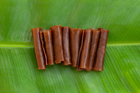 Dried mango paste on white background.の写真素材