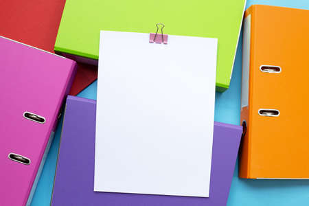 Paper with office folders on blue background. Top viewの写真素材