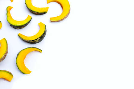 Green pumpkin pieces on white backgroundの写真素材