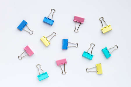 Colorful office paper clips on white background.の写真素材
