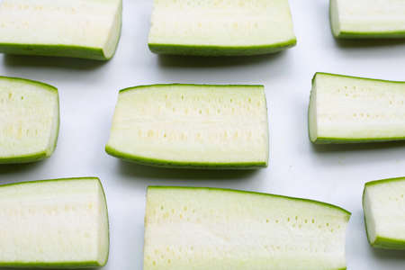 Fresh angled gourd on white background.の写真素材