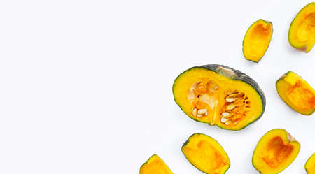 Green pumpkin pieces on white backgroundの写真素材