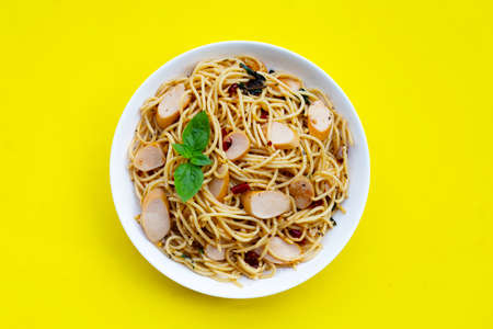 Spaghetti with dried chili and hot dogs