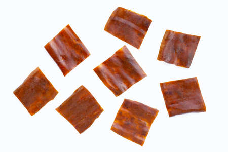Dried mango paste on white background.の写真素材