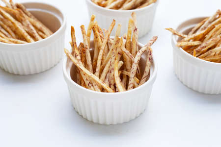 Fried taro sticks on white background.の写真素材