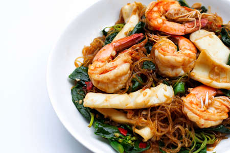 Spicy stir fried vermicelli with holy basil leaves and sea foodの写真素材