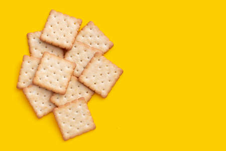 Dry cracker cookies on yellow background.の写真素材