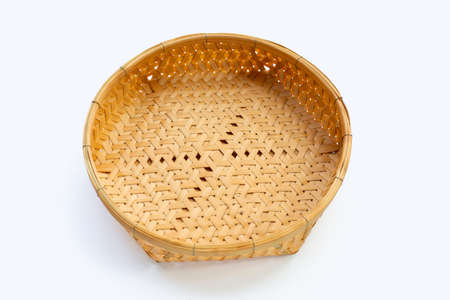 Empty wooden bamboo basket on white background.の写真素材