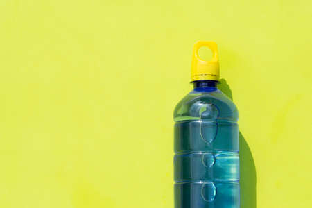Plastic water bottle on green surfaceの写真素材