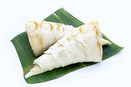 Bamboo shoots on banana leaf on whiteの写真素材