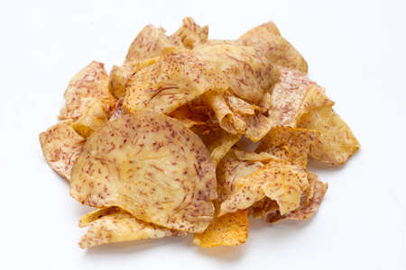 Crispy taro chips on white background.の写真素材
