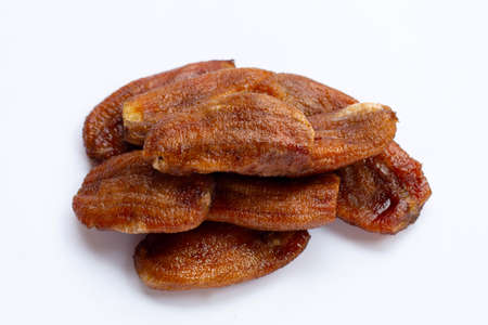 Sun dried bananas on white background.の写真素材
