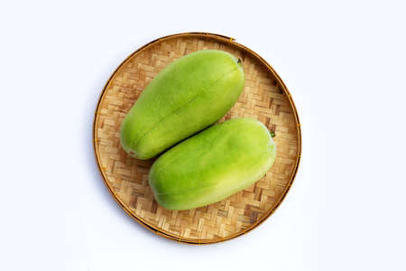 Winter melon in bamboo basket on white background.の写真素材