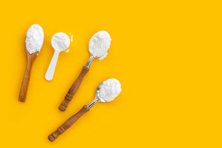 Baking soda on yellow background.の写真素材