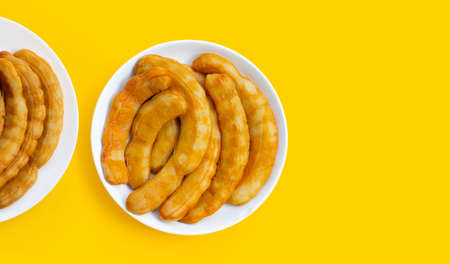 Tamarind pickled fermented on yellow background.の写真素材
