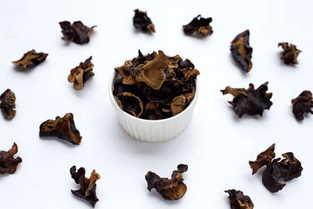 Dried black fungus on white background.の写真素材