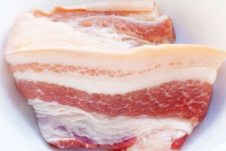 Streaky pork in white bowlの写真素材