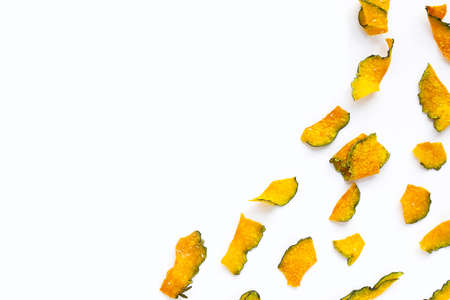 Green pumpkin slice chips on white background.の写真素材